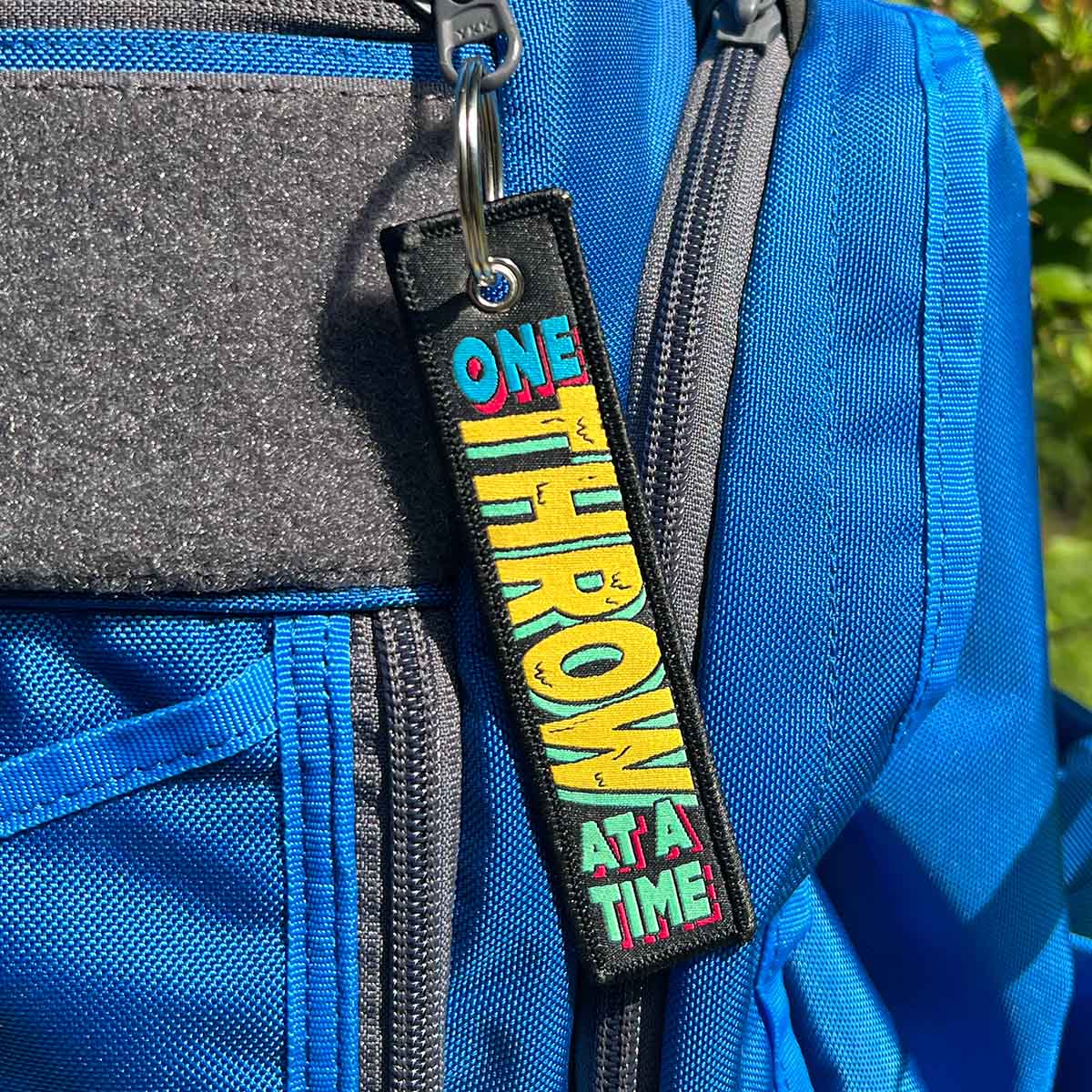 One Throw Disc Golf Fabric Keychain®